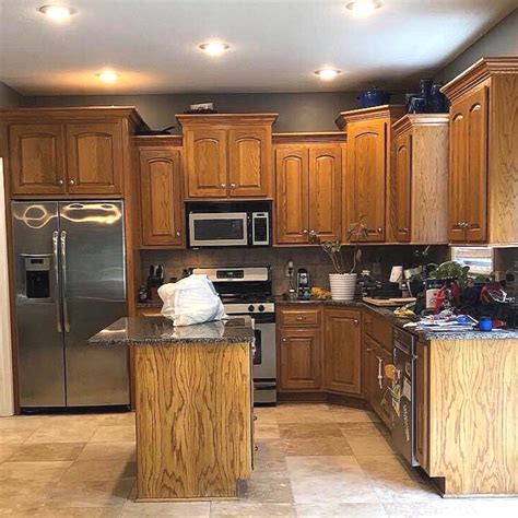 black stainless steel honey oak cabinets|honey oak alabaster cabinets.